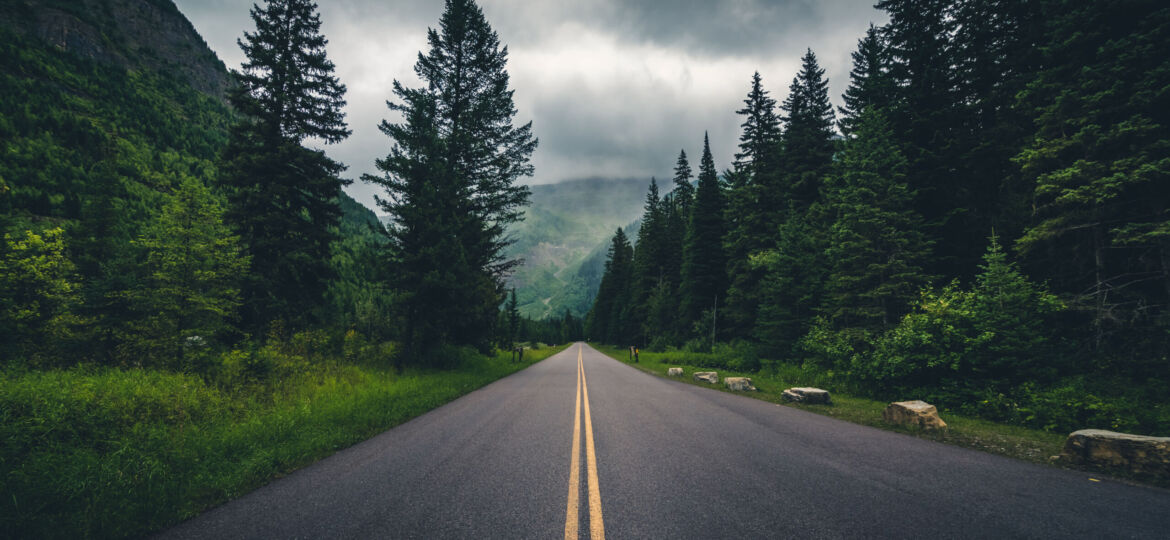Forest,Road,On,A,Cloudy,Day.,Glacier,National,Park,,Montana,