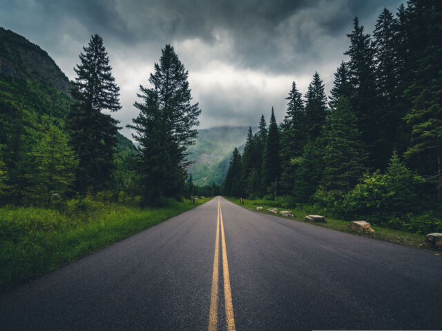 Forest,Road,On,A,Cloudy,Day.,Glacier,National,Park,,Montana,